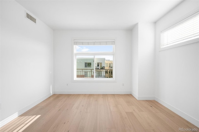 3301 Arapahoe Ave Unit 411, Boulder, CO 80303 - spare room with light wood-style flooring and baseboards