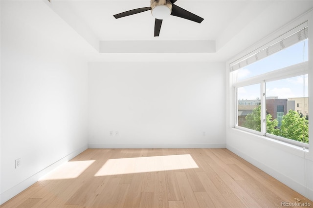 3301 Arapahoe Ave Unit 411, Boulder, CO 80303 - unfurnished room with a raised ceiling, wood finished floors, and ceiling fan