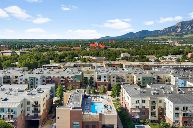 3301 Arapahoe Ave Unit 411, Boulder, CO 80303 - drone / aerial view of a pool area and mountains