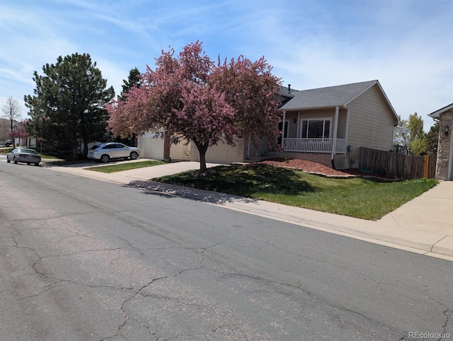 4483 S Fundy St, Centennial, CO 80015 - obstructed view of property featuring concrete driveway and a garage