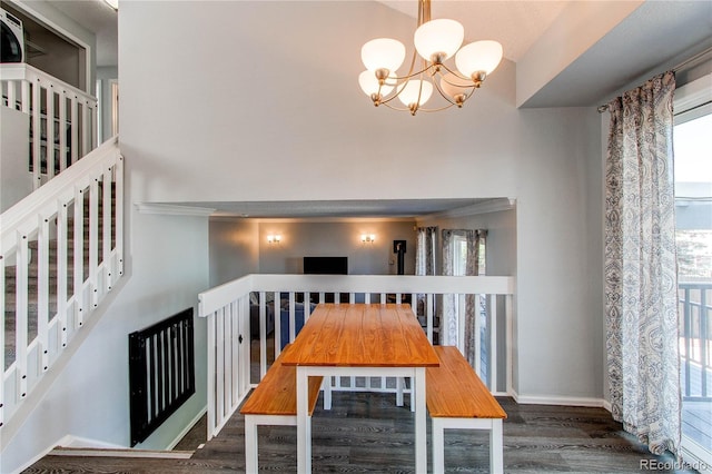 4483 S Fundy St, Centennial, CO 80015 - unfurnished dining area with a chandelier, wood finished floors, and a high ceiling