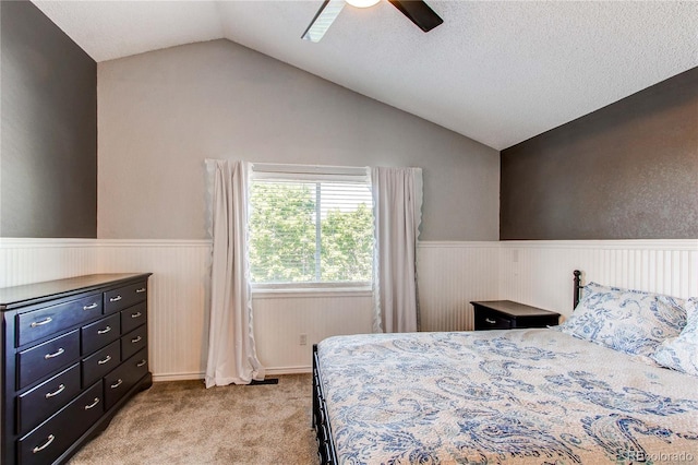 4483 S Fundy St, Centennial, CO 80015 - bedroom featuring lofted ceiling, a wainscoted wall, light carpet, and ceiling fan