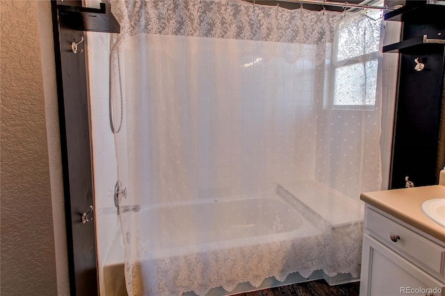 4483 S Fundy St, Centennial, CO 80015 - bathroom with shower / bath combo, vanity, and a textured wall