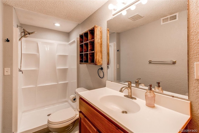 4483 S Fundy St, Centennial, CO 80015 - full bath featuring a textured wall, a textured ceiling, vanity, and a shower