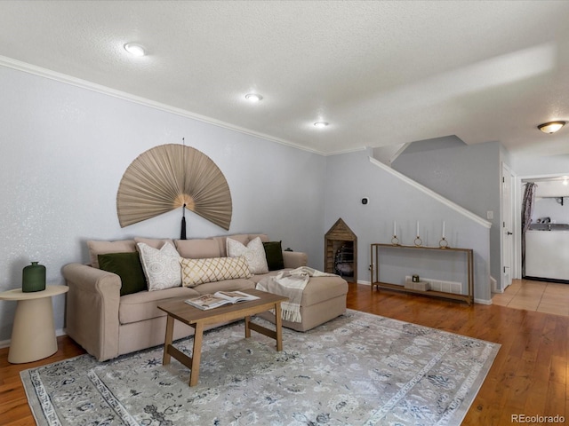 9696 E Kansas Cir Unit 2, Denver, CO 80247 - living room with wood finished floors, ornamental molding, stairway, and recessed lighting