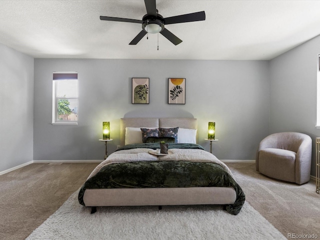 9696 E Kansas Cir Unit 2, Denver, CO 80247 - carpeted bedroom featuring baseboards and a ceiling fan