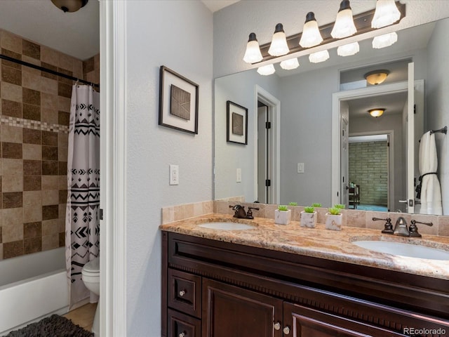 9696 E Kansas Cir Unit 2, Denver, CO 80247 - bathroom featuring double vanity and shower / tub combo