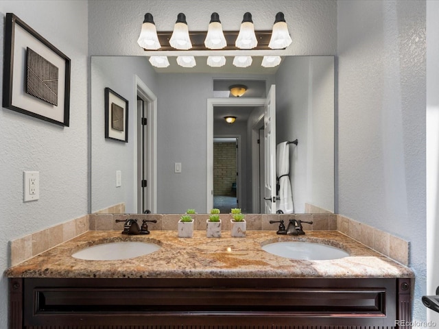 9696 E Kansas Cir Unit 2, Denver, CO 80247 - bathroom with double vanity and a textured wall