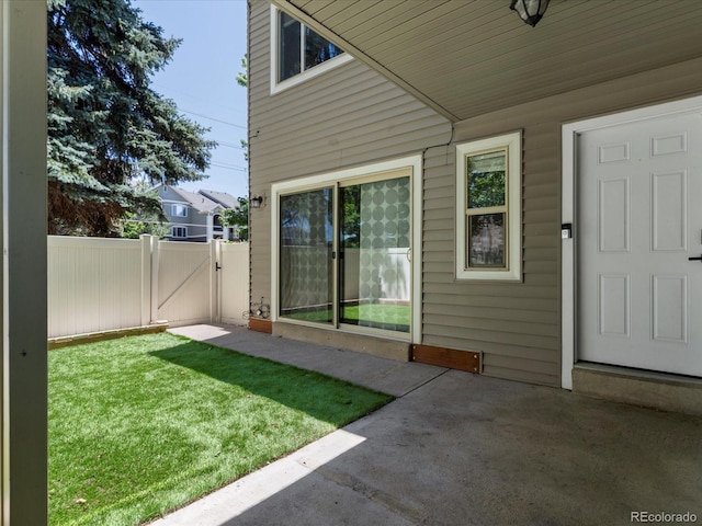 9696 E Kansas Cir Unit 2, Denver, CO 80247 - property entrance featuring a patio area and a gate