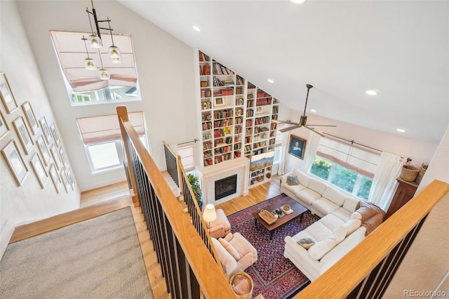 1455 Flowers Ct, Erie, CO 80516 - living room featuring high vaulted ceiling, a ceiling fan, recessed lighting, and wood finished floors