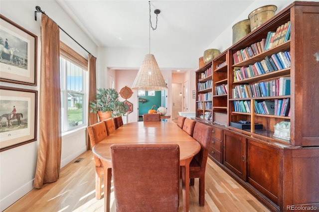 1455 Flowers Ct, Erie, CO 80516 - dining area featuring light wood-style floors, baseboards, and visible vents