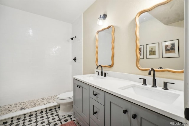 1455 Flowers Ct, Erie, CO 80516 - bathroom with double vanity, a sink, toilet, and tiled shower