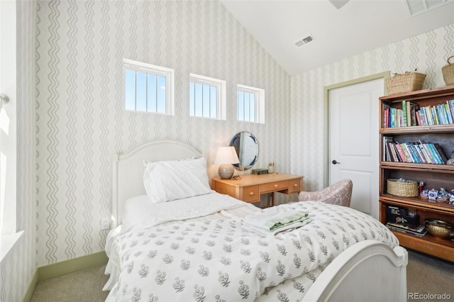 1455 Flowers Ct, Erie, CO 80516 - bedroom featuring visible vents, carpet, lofted ceiling, and wallpapered walls