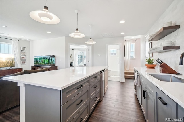 1455 Flowers Ct, Erie, CO 80516 - kitchen featuring open shelves, a sink, light countertops, gray cabinetry, and dark wood-style floors