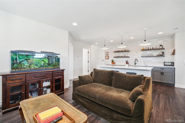 1455 Flowers Ct, Erie, CO 80516 - living room with visible vents, indoor wet bar, baseboards, recessed lighting, and dark wood-type flooring