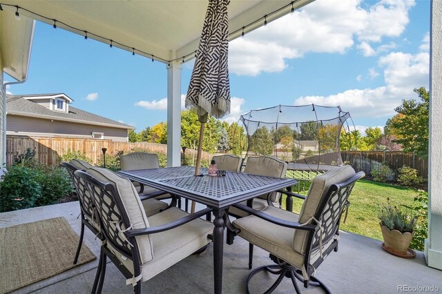 1455 Flowers Ct, Erie, CO 80516 - view of patio / terrace featuring a fenced backyard and outdoor dining area