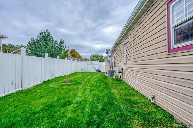 view of yard with central AC