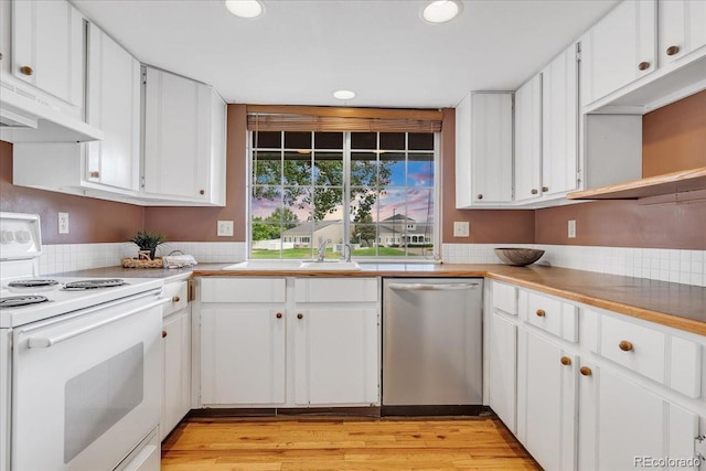 kitchen featuring white electric range, white cabinetry, and stainless steel dishwasher