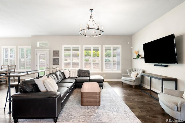 23421 E Rockinghorse Pkwy, Aurora, CO 80016 - living room featuring a chandelier, plenty of natural light, and dark wood-style flooring