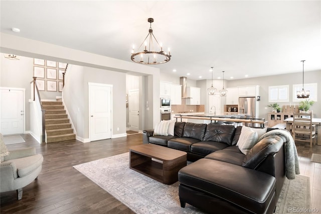 23421 E Rockinghorse Pkwy, Aurora, CO 80016 - living area featuring a chandelier, stairway, dark wood-type flooring, and recessed lighting