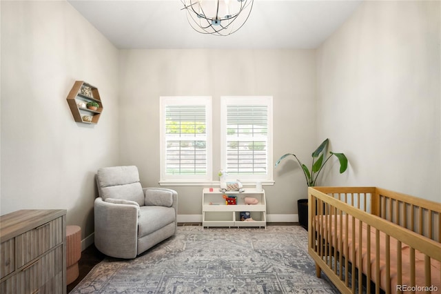 23421 E Rockinghorse Pkwy, Aurora, CO 80016 - bedroom with a nursery area and a chandelier
