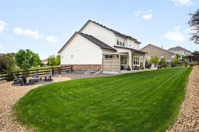 23421 E Rockinghorse Pkwy, Aurora, CO 80016 - back of property with a patio and stone siding