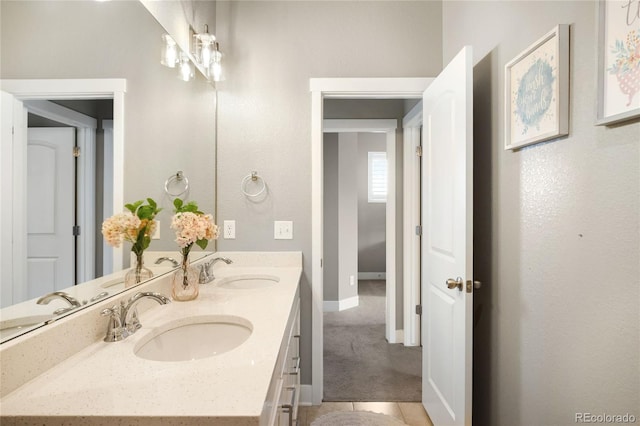 23421 E Rockinghorse Pkwy, Aurora, CO 80016 - bathroom featuring double vanity and baseboards
