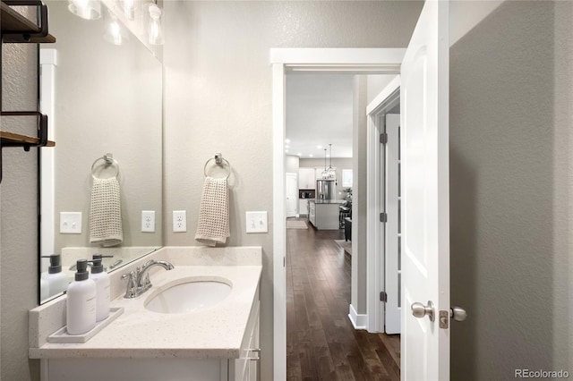 23421 E Rockinghorse Pkwy, Aurora, CO 80016 - bathroom featuring wood finished floors and vanity