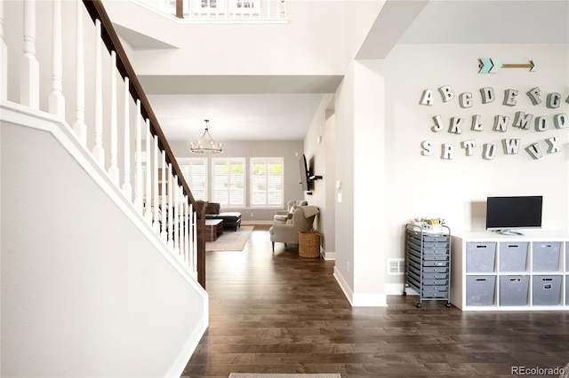 23421 E Rockinghorse Pkwy, Aurora, CO 80016 - entryway with wood finished floors, stairs, and a chandelier