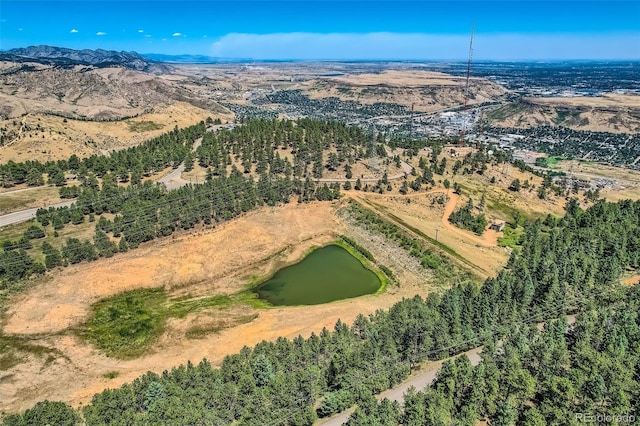 bird's eye view with a water and mountain view