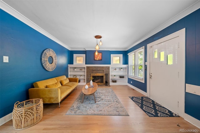 living room featuring ornamental molding and light hardwood / wood-style floors