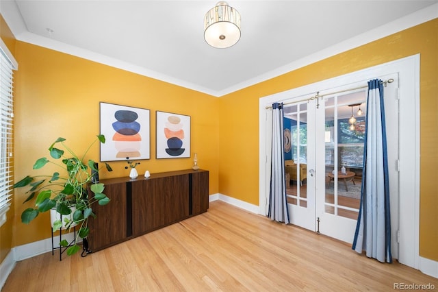 office area featuring crown molding and light hardwood / wood-style flooring