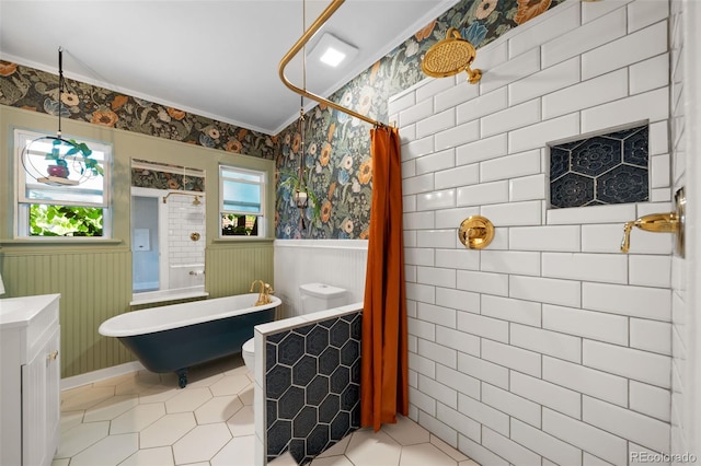 bathroom with independent shower and bath, ornamental molding, tile patterned floors, and vanity