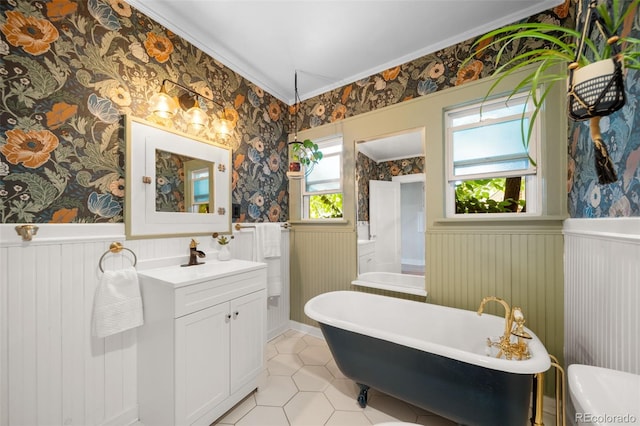 bathroom with vanity, a washtub, and tile patterned floors