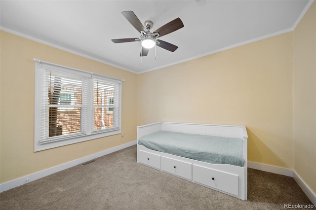 bedroom with crown molding, light colored carpet, and ceiling fan