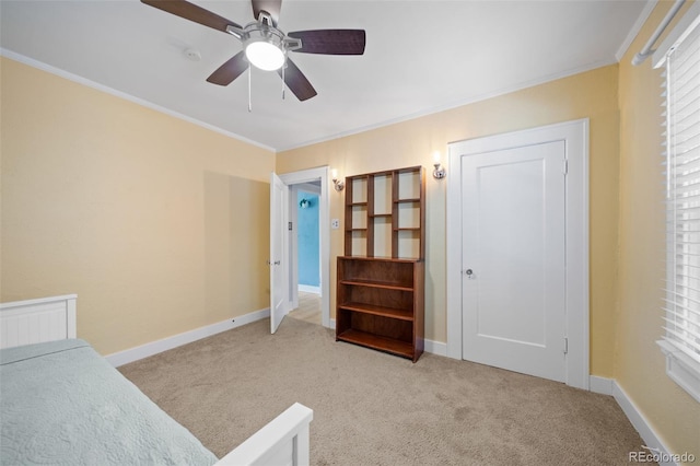 unfurnished bedroom with multiple windows, ceiling fan, ornamental molding, and light carpet