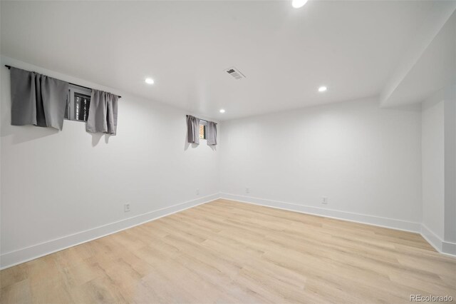 basement featuring light wood-type flooring