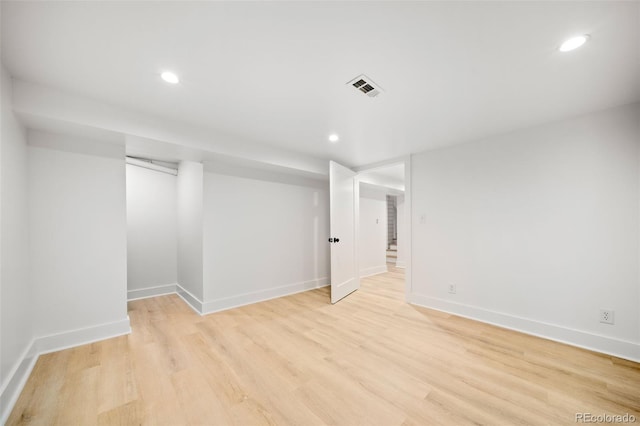 basement featuring light hardwood / wood-style flooring