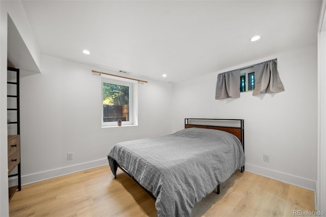 bedroom with light wood-type flooring