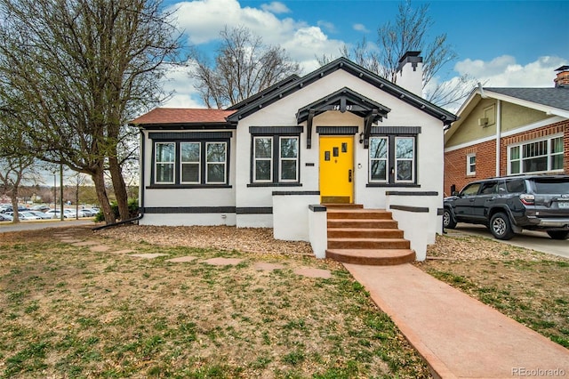 view of front of home featuring a chimney