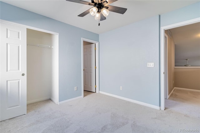 unfurnished bedroom featuring light carpet, a closet, and ceiling fan