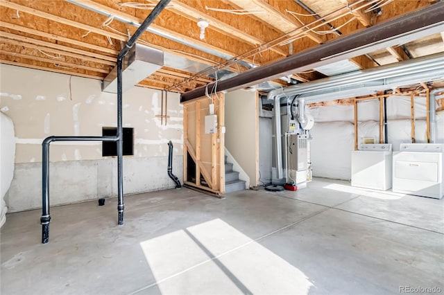 basement with separate washer and dryer and heating unit