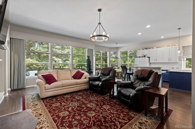 329 Bobcat Pt, Lafayette, CO 80026 - living area featuring plenty of natural light, dark wood finished floors, a chandelier, and recessed lighting