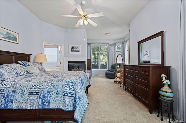329 Bobcat Pt, Lafayette, CO 80026 - bedroom with light carpet, a fireplace, and ceiling fan