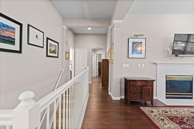 329 Bobcat Pt, Lafayette, CO 80026 - hall featuring arched walkways, dark wood-type flooring, and recessed lighting