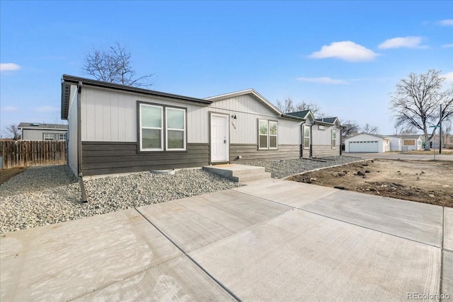 view of front of home featuring an outbuilding and a garage