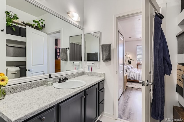 bathroom featuring vanity and hardwood / wood-style floors