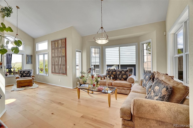 165 Washington St, Golden, CO 80403 - living room with light wood-type flooring, high vaulted ceiling, baseboards, and a fireplace
