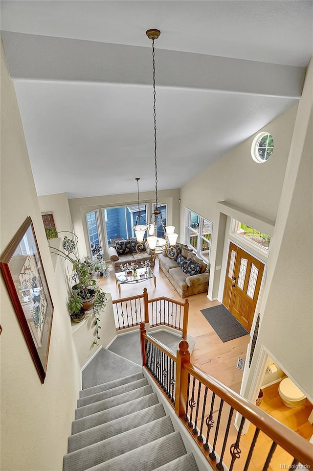 165 Washington St, Golden, CO 80403 - staircase with a chandelier and wood finished floors