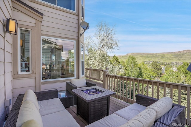 165 Washington St, Golden, CO 80403 - wooden deck with an outdoor living space with a fire pit and a mountain view